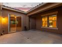 A private courtyard with sliding glass doors leading to the interior of the house at 21438 S 194Th St, Queen Creek, AZ 85142