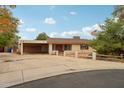 Single-story home with attached garage and desert landscaping at 2546 E Hale St, Mesa, AZ 85213