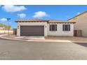 Front view of a single-story home with a two-car garage and desert landscaping at 2955 N Augustine --, Mesa, AZ 85207