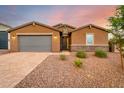 Single-story home with gray door and brick accents at 4969 W Beckham Way, San Tan Valley, AZ 85144