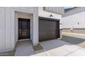 Exterior shot of a home featuring a driveway, garage door, and entrance at 7450 S 75Th Dr, Laveen, AZ 85339