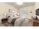 Inviting bedroom featuring a plush bed, soft lighting, and large window at 8653 E Royal Palm Rd # 2005, Scottsdale, AZ 85258