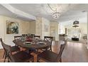 Charming dining room showcases a stylish table setting and wood flooring at 8653 E Royal Palm Rd # 2005, Scottsdale, AZ 85258