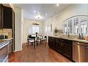 Cozy kitchen boasts granite countertops, stainless steel appliances, and a breakfast nook at 8653 E Royal Palm Rd # 2005, Scottsdale, AZ 85258