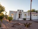Inviting home features a Southwestern design, low-maintenance landscaping, and charming architectural details at 14211 N Fountain Hills Blvd # B, Fountain Hills, AZ 85268