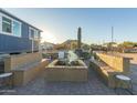 Inviting outdoor firepit area with built-in seating and desert landscape at 10120 E Mclellan Rd, Mesa, AZ 85207