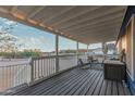 Relaxing covered porch with seating area showcasing beautiful neighborhood views and a bright sky at 10120 E Mclellan Rd, Mesa, AZ 85207