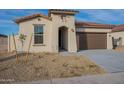 New construction home with attractive curb appeal and two-car garage at 24144 W Gibson Ln, Buckeye, AZ 85326