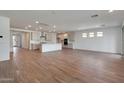 Open concept kitchen with island, stainless steel appliances, and light cabinets at 26367 S 231St Way, Queen Creek, AZ 85142