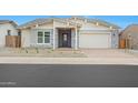 Attractive one-story house boasting a stone-accented entrance, a brick-paved driveway, and low-maintenance landscaping at 44713 N 44Th Dr, Phoenix, AZ 85087