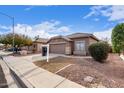 House exterior showcasing a front yard and driveway at 15829 W Carmen Dr, Surprise, AZ 85374