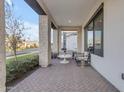 Inviting front porch with brick flooring, modern furniture, and a view of the street at 3901 E Sagebrush St, Gilbert, AZ 85296