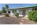 House exterior featuring a covered porch and landscaping at 6908 E Windsor Ave, Scottsdale, AZ 85257