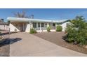 Home with a long driveway and carport at 6908 E Windsor Ave, Scottsdale, AZ 85257