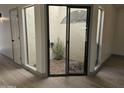 Private courtyard access from interior of home with gravel and plants at 7955 E Chaparral Rd # 103, Scottsdale, AZ 85250