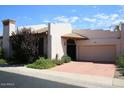 Spanish style home with a two-car garage at 7955 E Chaparral Rd # 103, Scottsdale, AZ 85250