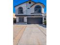 Two-story house with a two-car garage and a well-maintained front yard at 7313 N 69Th Ave, Glendale, AZ 85303