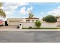 Charming single-Gathering home featuring a red tile roof, stucco walls, and mature landscaping at 629 E Myrtle Ave, Phoenix, AZ 85020