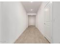 Bright hallway with tile flooring and interior doors at 7280 E White Tail Rd, San Tan Valley, AZ 85143