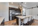 Modern kitchen with stainless steel appliances and an island at 14953 W Cortez St, Surprise, AZ 85379