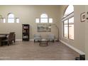 Bright living room featuring tile floors, stylish furniture, and large arched windows at 3650 N Barron --, Mesa, AZ 85207