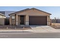 New home with a front yard, driveway, and a two-car garage at 9109 N 173Rd Ln, Waddell, AZ 85355