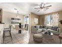 Inviting living room with tile floors, a cozy seating area, and a sliding glass door at 1335 E June St # 239, Mesa, AZ 85203