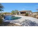 Inviting backyard pool with a concrete deck and desert landscaping, perfect for outdoor entertaining at 3701 E Sat Nam Way, Cave Creek, AZ 85331
