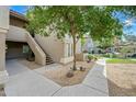 Inviting apartment exterior with well-kept landscaping and stairs leading to upper units at 9600 N 96Th St # 130, Scottsdale, AZ 85258