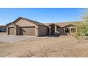 Contemporary home with a three-car garage and desert landscaping at 35852 N 10Th St, Phoenix, AZ 85086