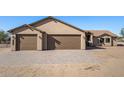 New construction home with three-car garage and paved driveway at 35852 N 10Th St, Phoenix, AZ 85086