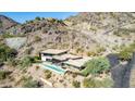 Aerial view of home, pool, and hillside location at 4060 E Lamar Rd, Paradise Valley, AZ 85253