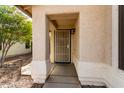 Front entry with security door and walkway at 8549 W El Caminito Dr, Peoria, AZ 85345