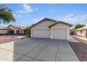 House exterior showcasing a two-car garage at 8549 W El Caminito Dr, Peoria, AZ 85345