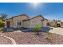 Inviting front exterior features a well-maintained lawn and desert landscaping at 8549 W El Caminito Dr, Peoria, AZ 85345