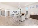 Bright living room with fireplace, large windows, and neutral color palette at 11260 N 92Nd St # 1080, Scottsdale, AZ 85260