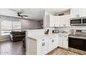 Kitchen with white cabinets and quartz countertops at 4315 E Nancy Ln, Phoenix, AZ 85042