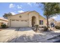 Charming single-story home with a neutral facade, two-car garage and a well-maintained front yard at 17317 N Ponca Way, Surprise, AZ 85374