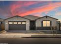 Beautiful one-story home with a two-car garage and stone accents at 17709 W Southgate Ave, Goodyear, AZ 85338