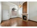 Living room with hardwood floors, fireplace and door to outside at 18608 N 4Th Ave, Phoenix, AZ 85027