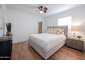 Spacious bedroom with hardwood floors and a comfortable bed at 2021 W Osborn Rd, Phoenix, AZ 85015