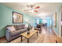 Bright living room featuring hardwood floors and a cozy sitting area at 2021 W Osborn Rd, Phoenix, AZ 85015