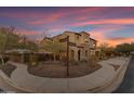 Two-story home with arched entryway and landscaped yard at 2322 E Samantha Way, Phoenix, AZ 85042