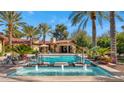 Inviting pool and spa with fountains, surrounded by palm trees and landscaping at 8306 N Merion Way, Paradise Valley, AZ 85253