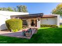 Charming home exterior features a well-maintained lawn and tiled front patio with a pergola at 15233 N 5Th Ave, Phoenix, AZ 85023
