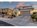 Two-story home with gray garage door and desert landscaping at 17408 N 96Th Way, Scottsdale, AZ 85255