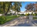 Stunning home with a brick paver driveway and lush landscaping at 20668 E Sunset Dr, Queen Creek, AZ 85142