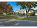 Beautiful home with mature trees and a large front yard at 20668 E Sunset Dr, Queen Creek, AZ 85142