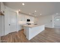 Bright kitchen featuring a spacious island, modern appliances, and stylish cabinetry at 17316 W Via Dona Rd, Surprise, AZ 85387
