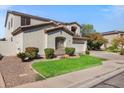 Attractive two-story home with a well-maintained lawn and desert landscaping at 2264 S Sorrelle --, Mesa, AZ 85209